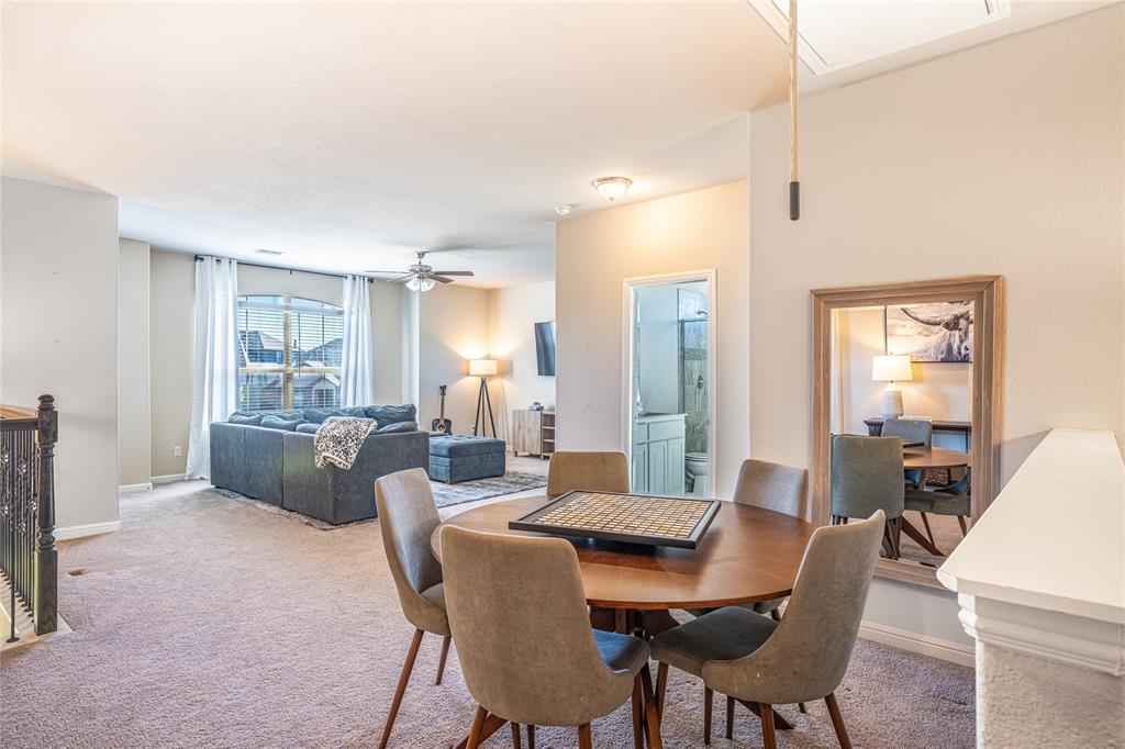 2404 Blackrail Court Argyle, TX 76226 - Photo 17 of 40 a view of a dining room with furniture