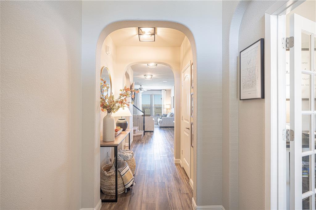 2404 Blackrail Court Argyle, TX 76226 - Photo 3 of 40 a view of a hallway view with wooden floor and a living room