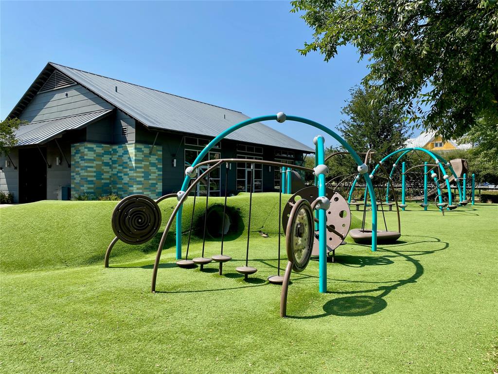 2404 Blackrail Court Argyle, TX 76226 - Photo 34 of 40 a view of playground with a slide and swing