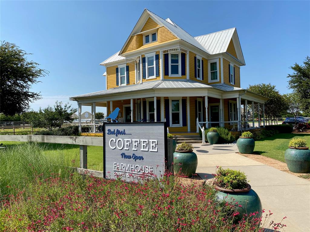 2404 Blackrail Court Argyle, TX 76226 - Photo 36 of 40 a front view of a house with a yard table and chairs