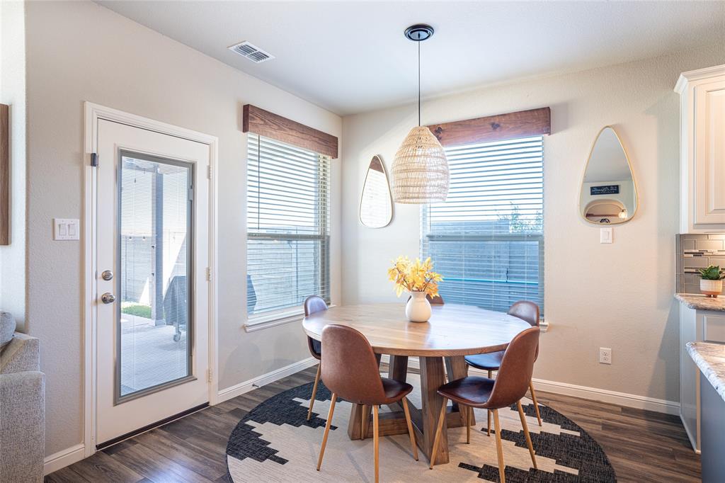 2404 Blackrail Court Argyle, TX 76226 - Photo 10 of 40 a view of a dining room with furniture window and wooden floor