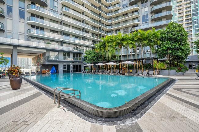 121 Northeast 34th Street, Unit L303 Miami, FL 33137 - Photo 23 of 31 a view of a swimming pool with a patio