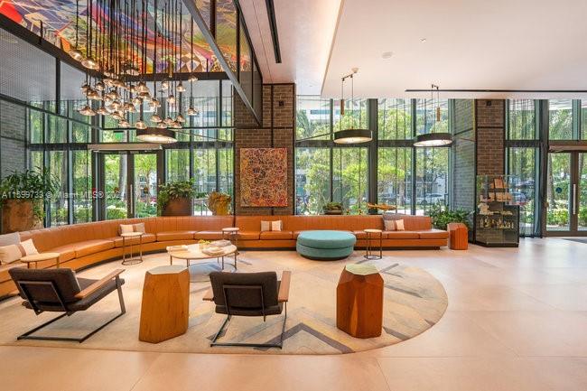 121 Northeast 34th Street, Unit L303 Miami, FL 33137 - Photo 6 of 31 a outdoor space with patio furniture and a potted plant