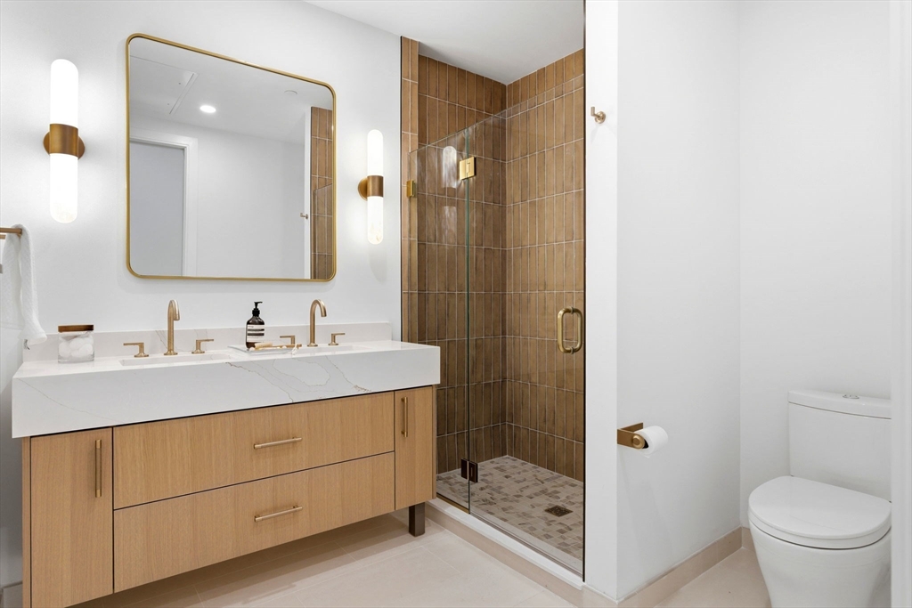 1114 Beacon Street, Unit 207 Newton, MA 02461 - Photo 14 of 29 a bathroom with a sink toilet and shower