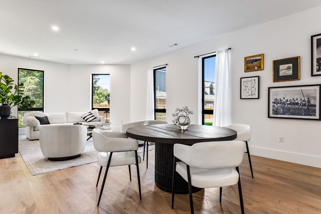 1114 Beacon Street, Unit 207 Newton, MA 02461 - Photo 17 of 38 a view of a dining room with furniture and wooden floor