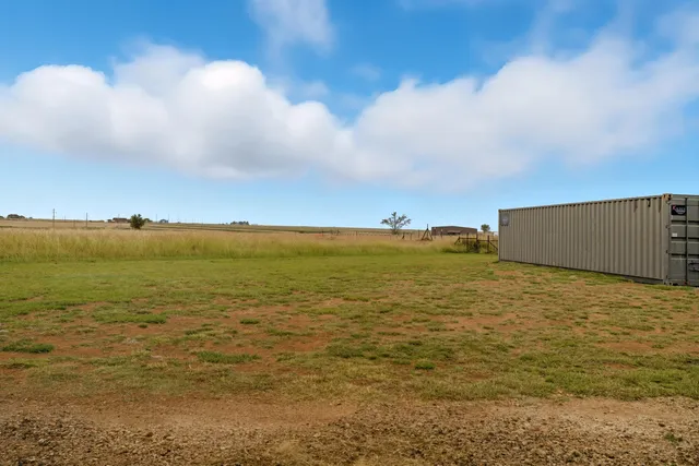 a bed room with a bed furniture and a flat screen tv