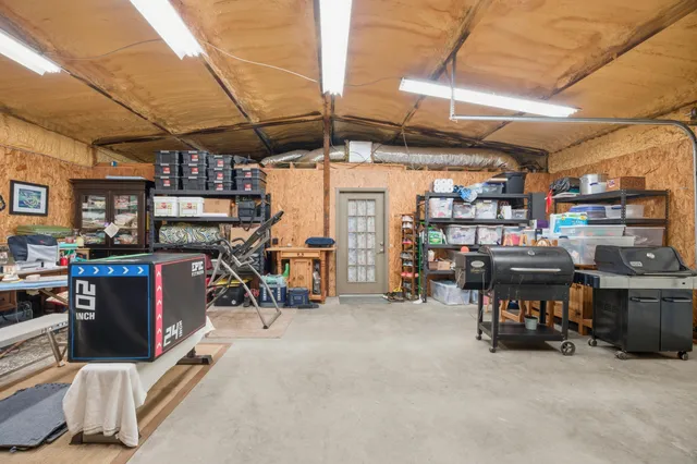 a bedroom with furniture and a flat screen tv