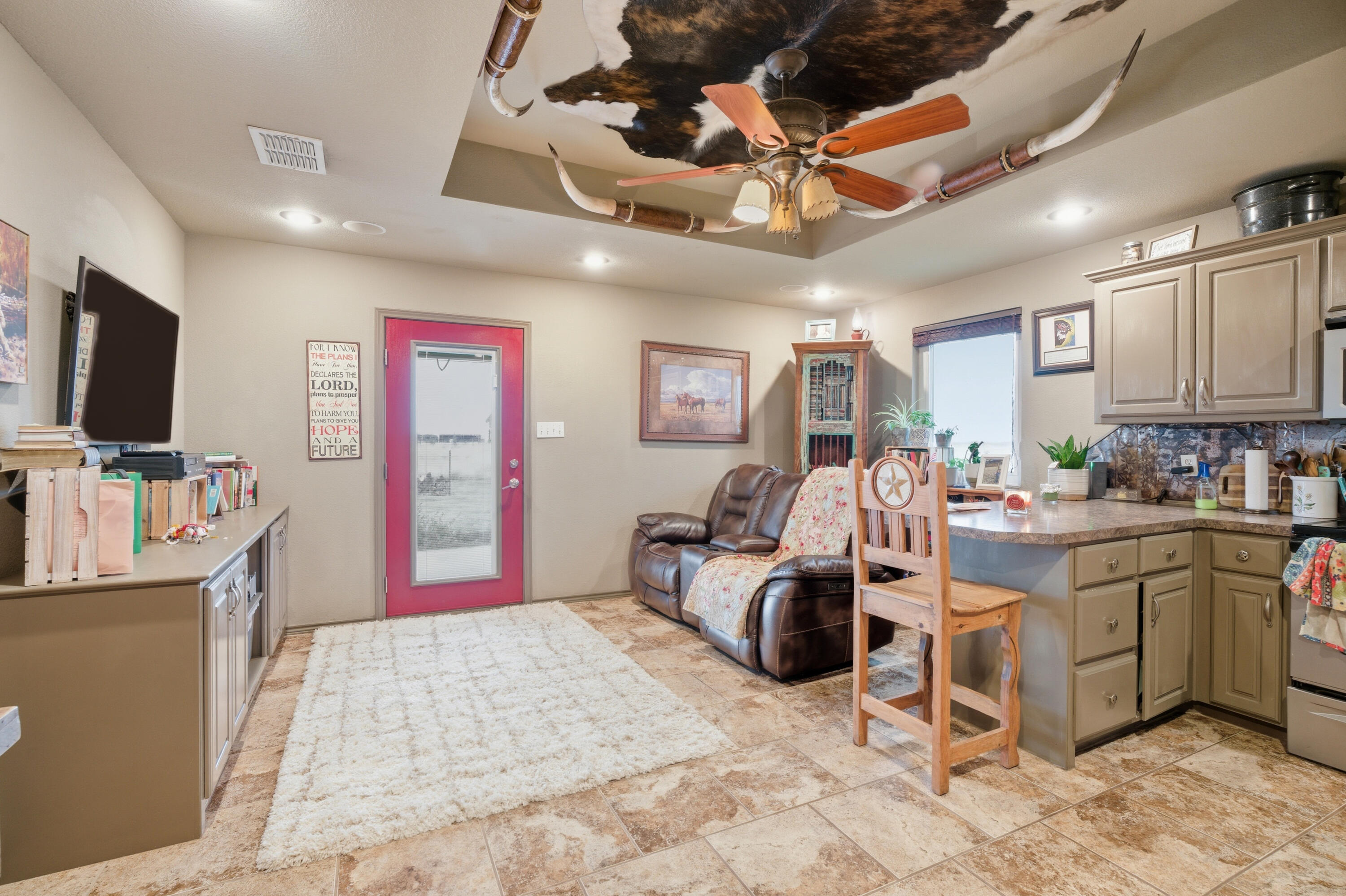 672 Cr M Road New Home, TX 79381 - Photo 17 of 30 a bed room with a bed furniture and a flat screen tv