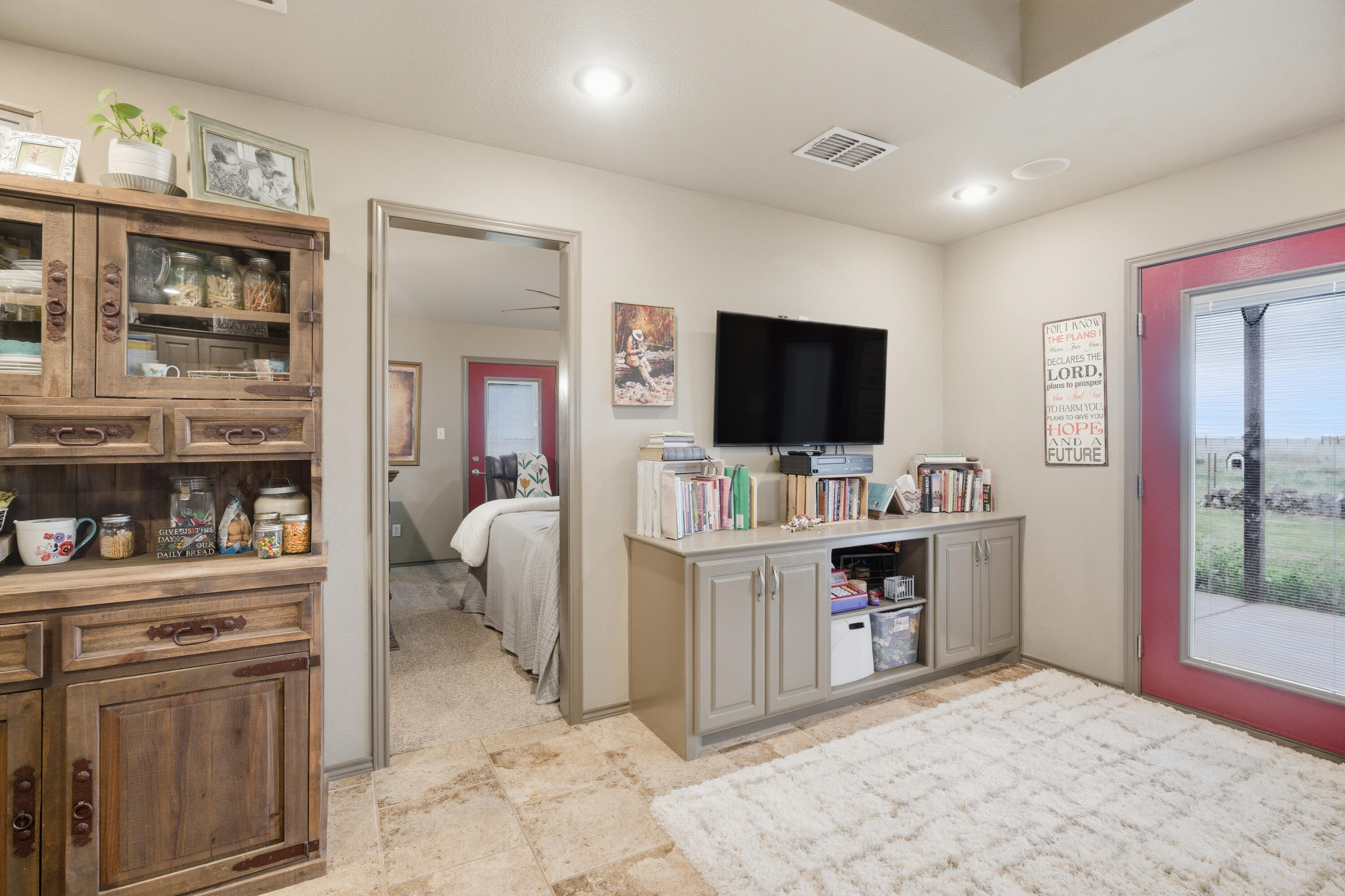 672 Cr M Road New Home, TX 79381 - Photo 24 of 30 a view of living room kitchen with flat screen tv and outdoor view
