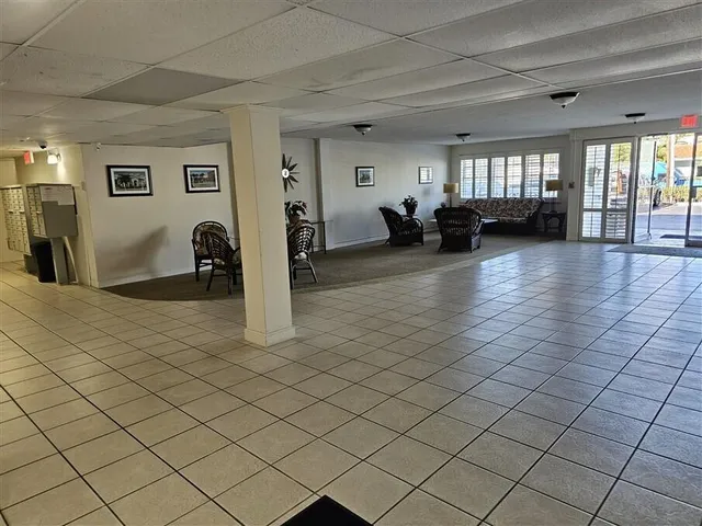 a kitchen with stainless steel appliances granite countertop a stove a sink and white cabinets