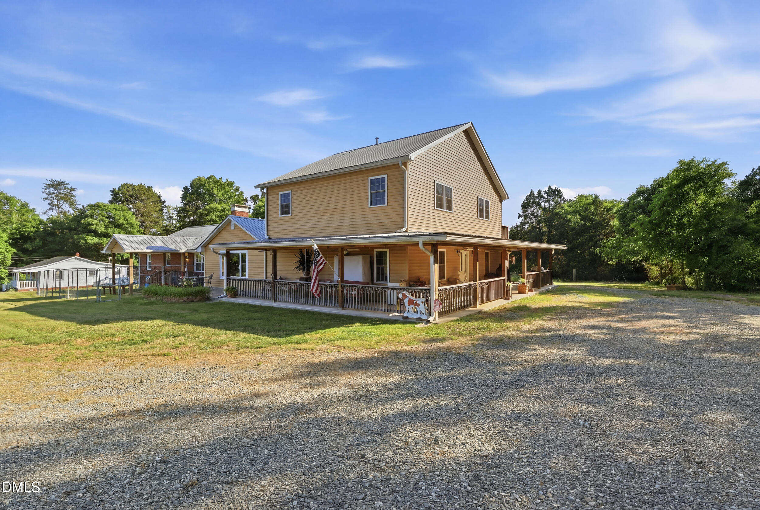 2631 South Jim Minor Road Haw River, NC 27258 - Photo 44 of 62 a front view of a house with a big yard and potted plants