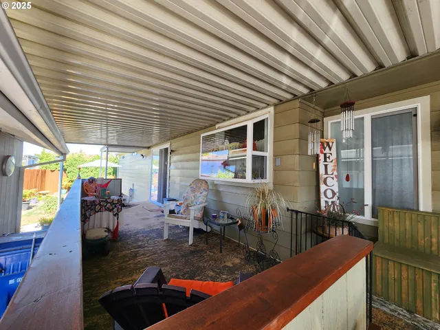 a view of a patio with couple of chairs