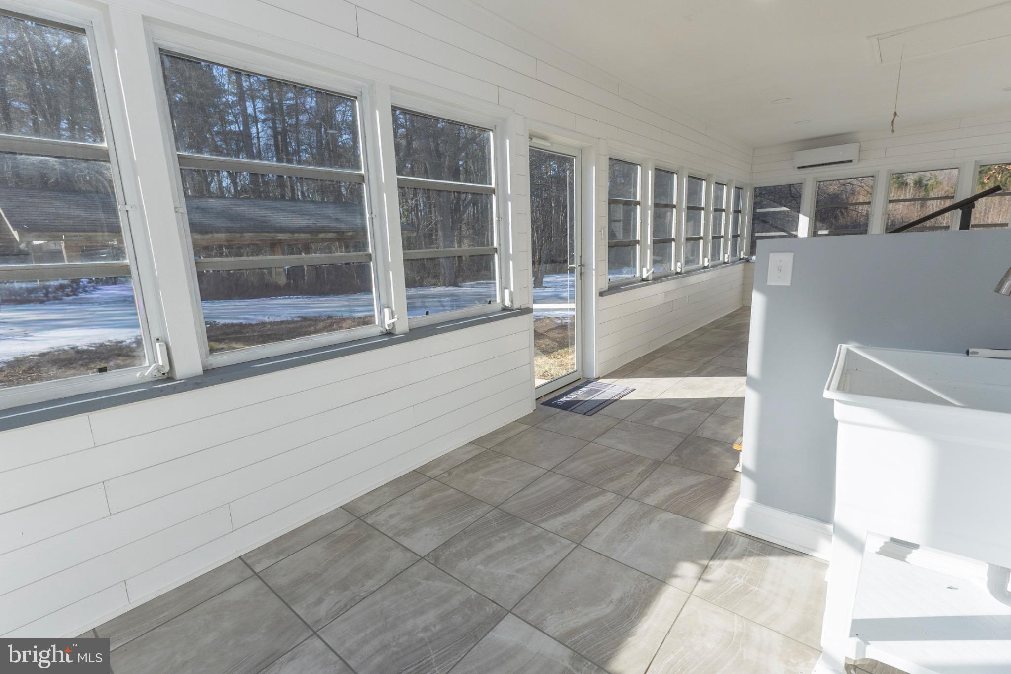 49151 Wynne Road Ridge, MD 20680 - Photo 53 of 80 Bright and airy sunroom with scenic views.