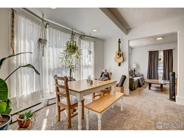 a view of a livingroom with furniture and a potted plant
