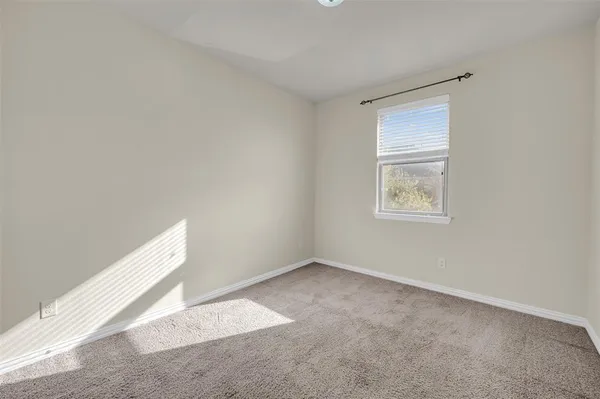 view of a bathroom with mirror and shower