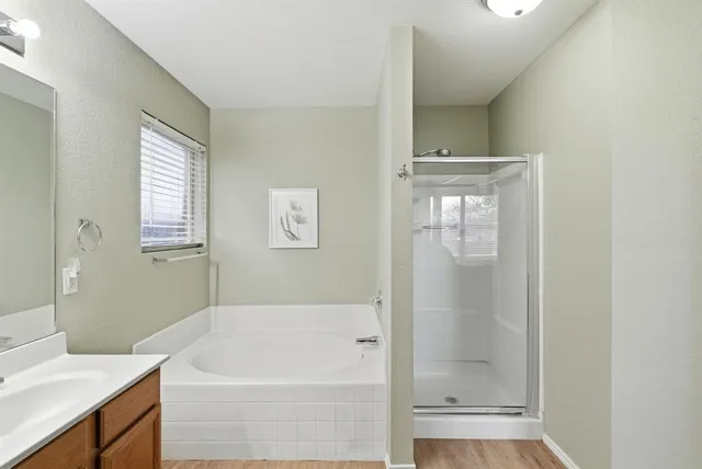 a bathroom with a bathtub and a sink
