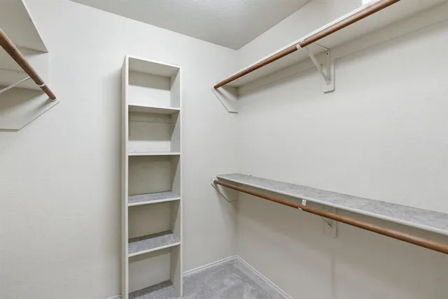 a view of an empty walk in closet