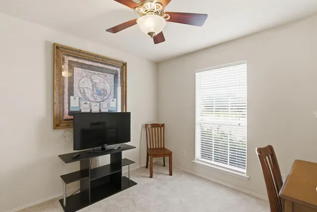 a view of a livingroom with furniture and a flat screen tv