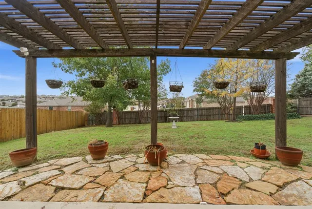 a view of a big yard with a house