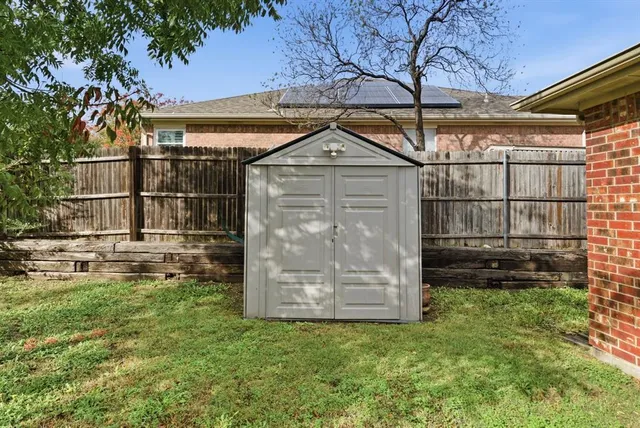 a view of a house with backyard and porch