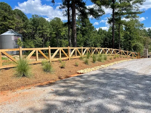 a view of swimming pool with a yard