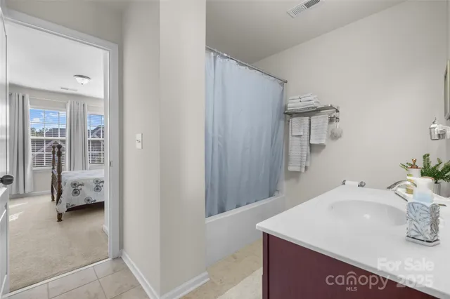 a en suite bathroom with a sink and a mirror