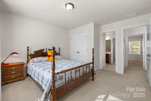 a bedroom with a bed and gym equipment