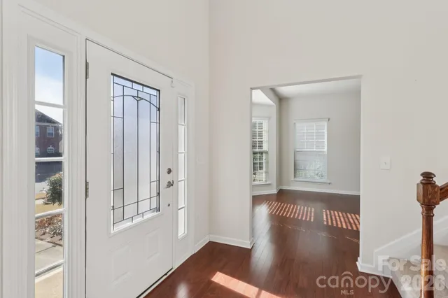 a kitchen with stainless steel appliances granite countertop a sink a stove a refrigerator and island