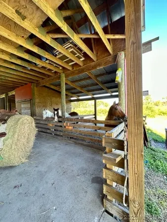 an aerial view of house with yard swimming pool and outdoor seating