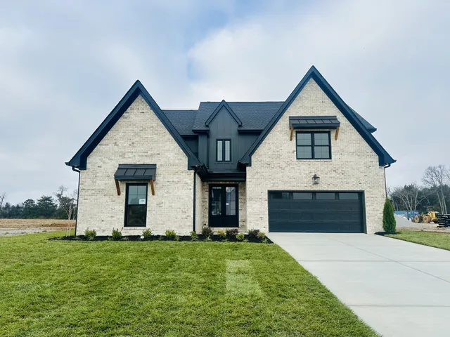 front view of a house with a yard