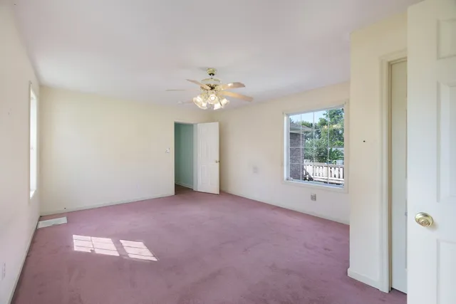 a view of a balcony with wooden floor