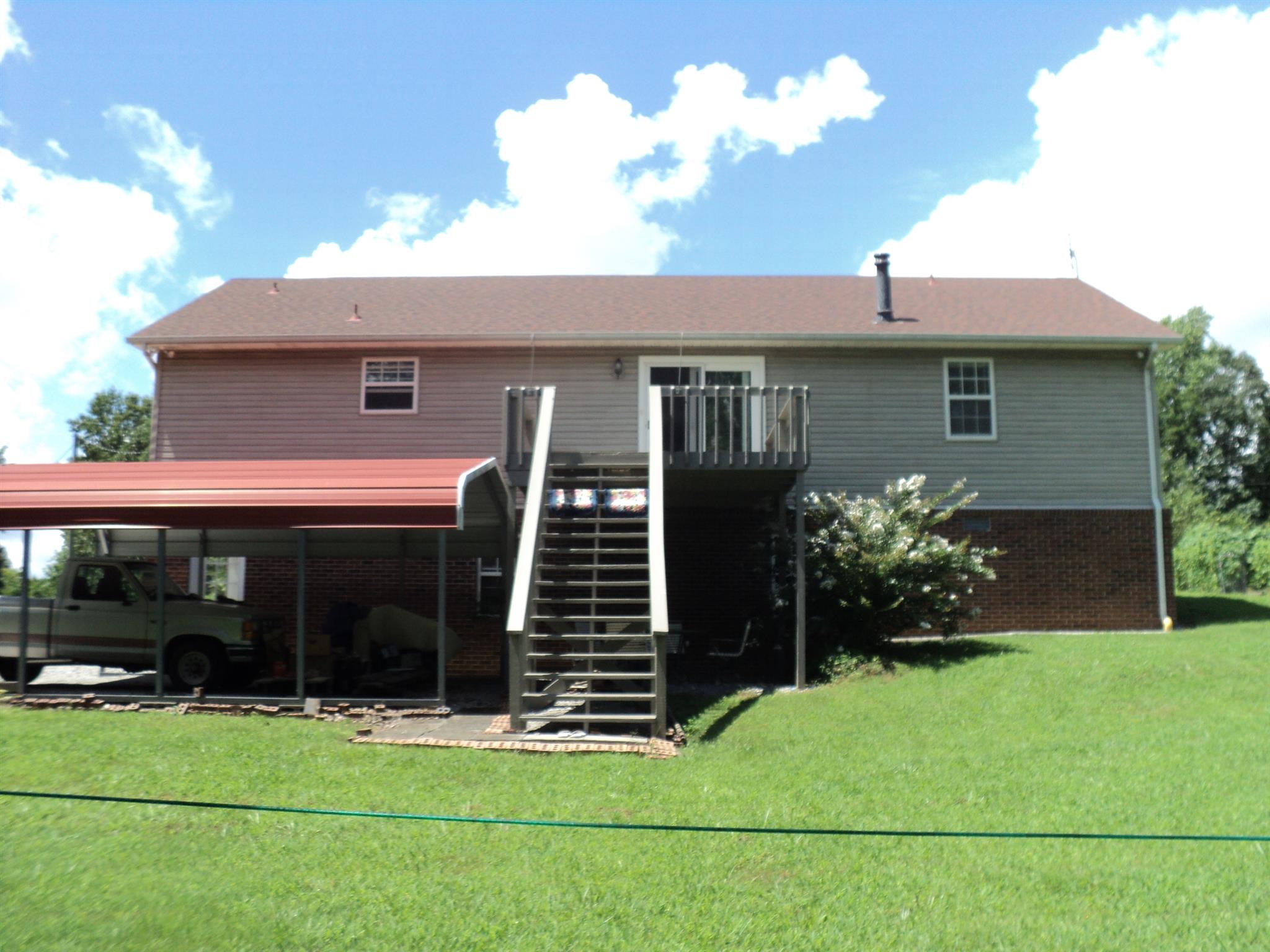 large deck located on the back of the home.