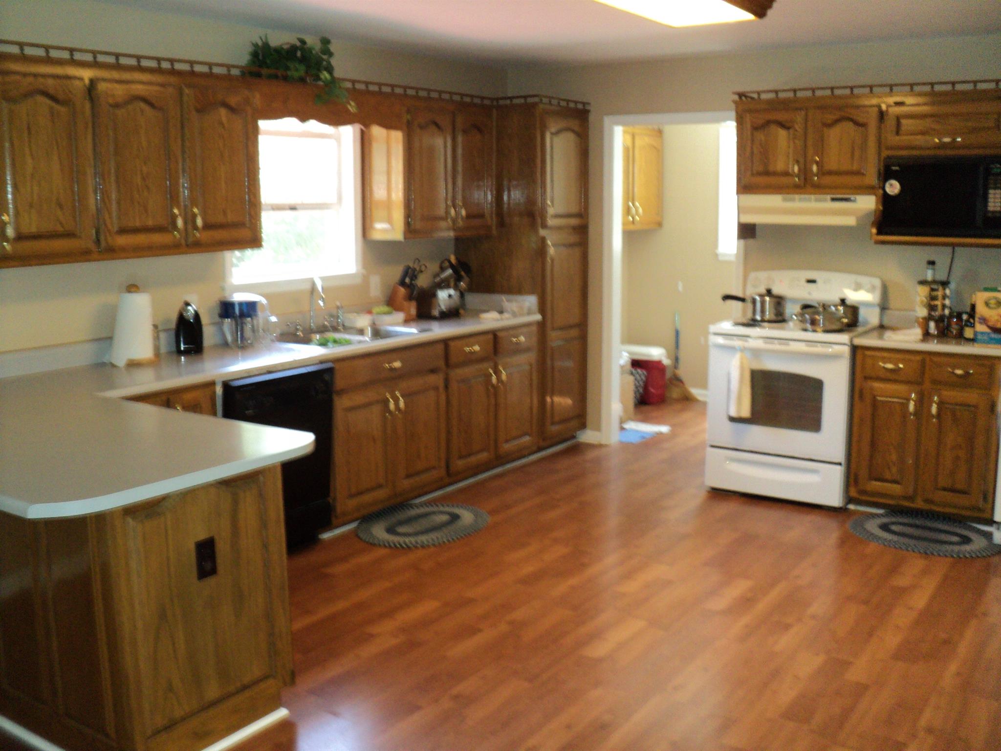 1135 Nancy Green Ridge Road Prospect, TN 38477 - Photo 8 of 20 Large spacious kitchen w/ solid oak cabinets and laminate flooring.