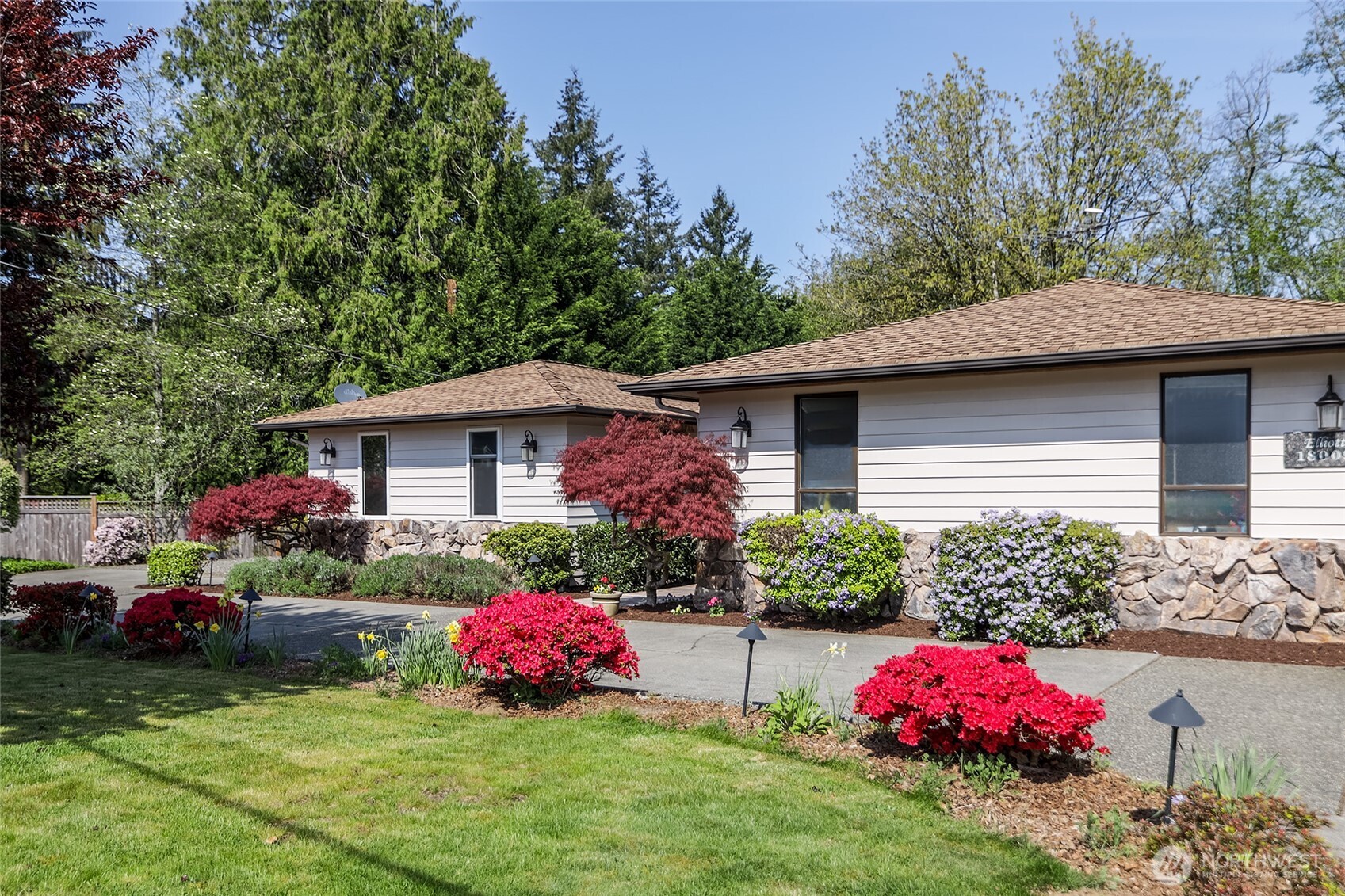 18009 Bellflower Road Bothell, WA 98012 - Photo 11 of 40 a front view of a house with garden