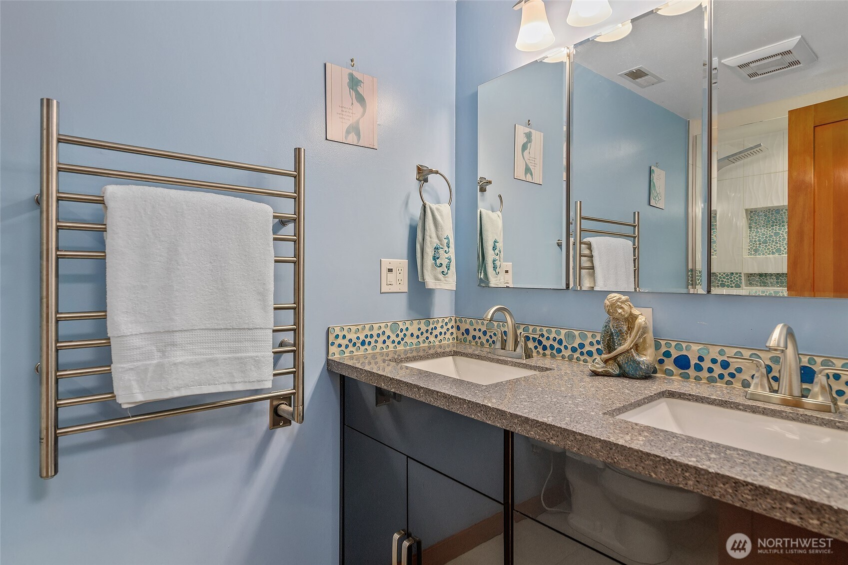 18009 Bellflower Road Bothell, WA 98012 - Photo 21 of 40 a bathroom with a sink and a mirror