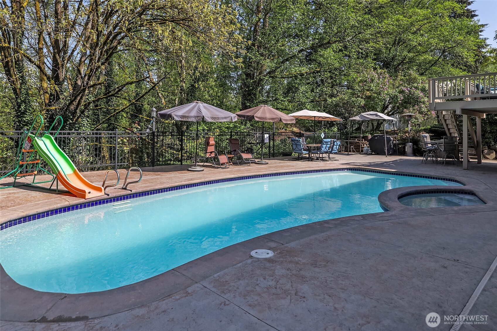 18009 Bellflower Road Bothell, WA 98012 - Photo 23 of 40 an outdoor space with swimming pool and furniture