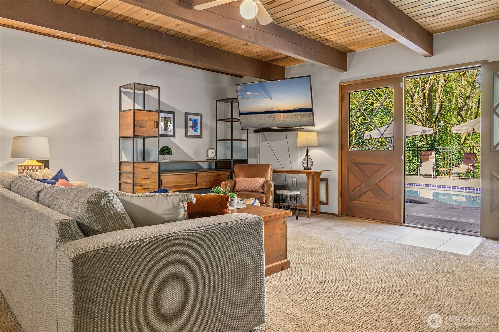 18009 Bellflower Road Bothell, WA 98012 - Photo 26 of 40 a living room with furniture and a floor to ceiling window