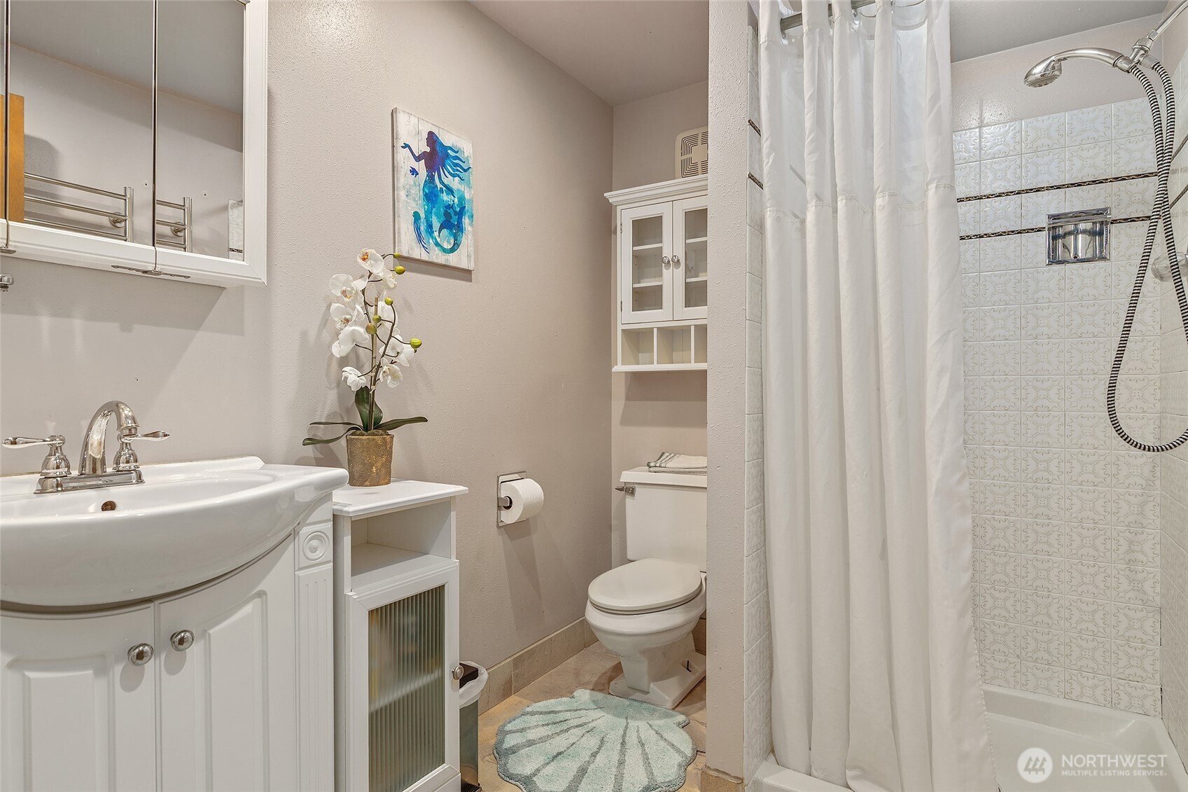 18009 Bellflower Road Bothell, WA 98012 - Photo 31 of 40 a bathroom with a sink a toilet and shower