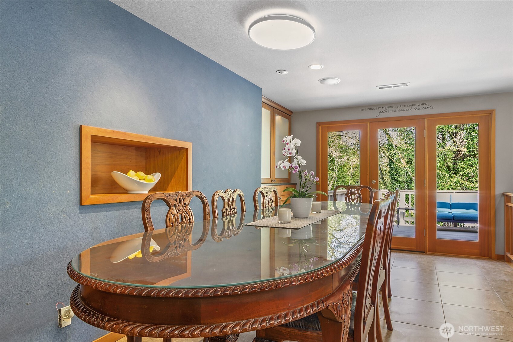18009 Bellflower Road Bothell, WA 98012 - Photo 9 of 40 a dining room with furniture a large window and wooden floor