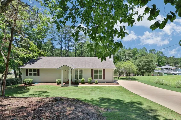 a front view of a house with a yard