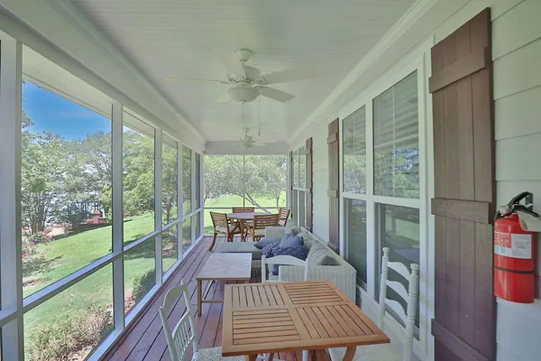 a view of a room with furniture and a balcony