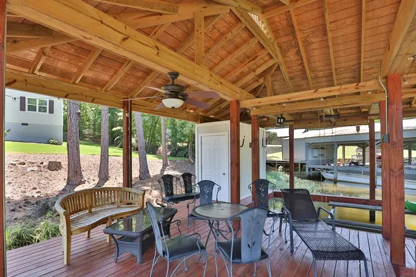 a view of a dining room with furniture wooden floor and a potted plant