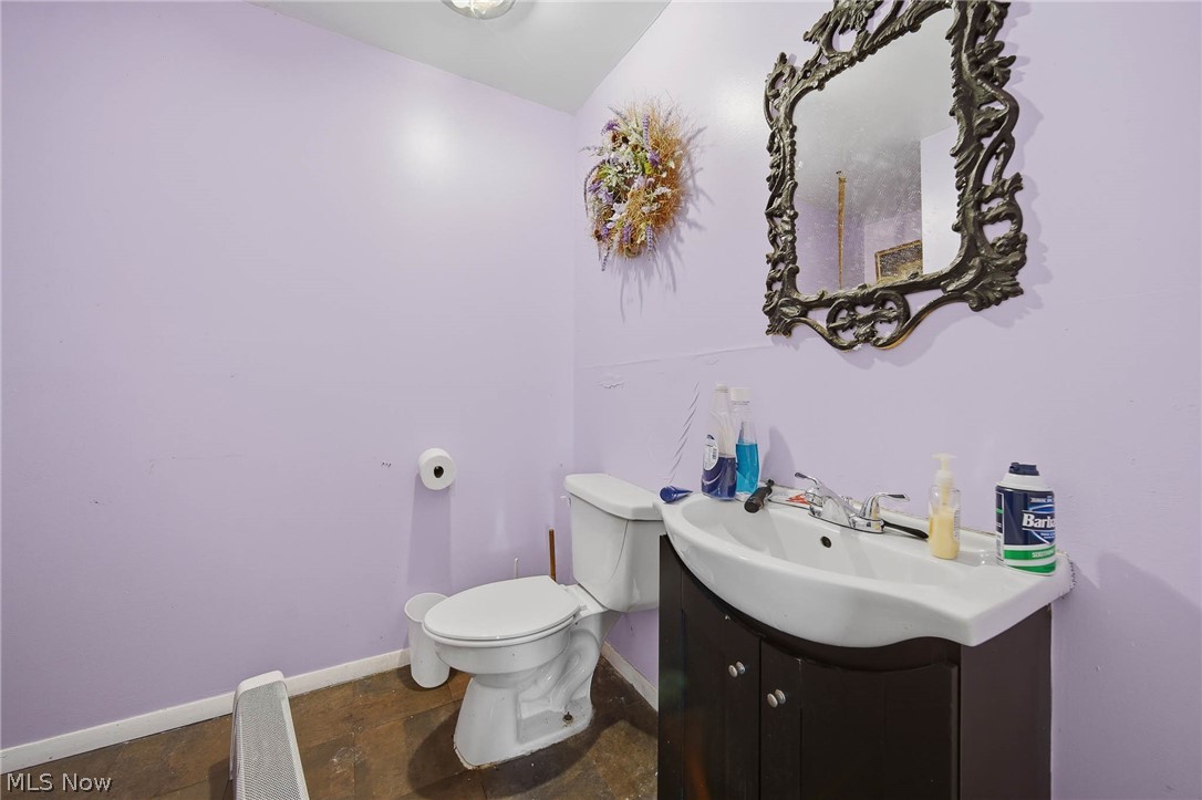 4677 Rock Spring Road Ravenna, OH 44266 - Photo 10 of 35 Half bathroom with vanity and stone finish floors