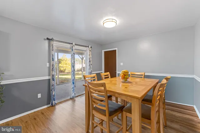 a view of a dining table and chairs in the room