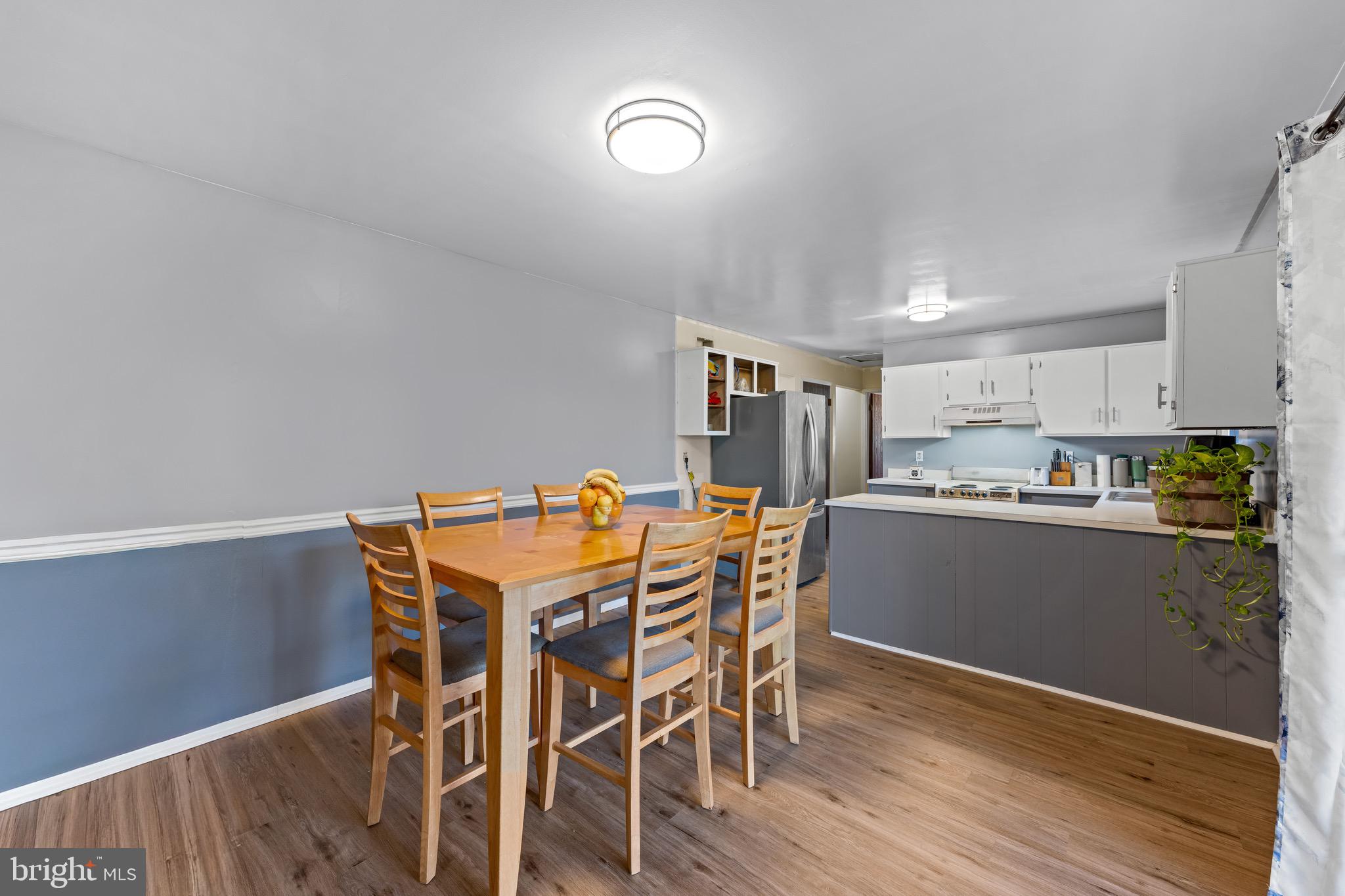284 Radix Road Williamstown, NJ 08094 - Photo 13 of 30 a view of a dining room with furniture and wooden floor