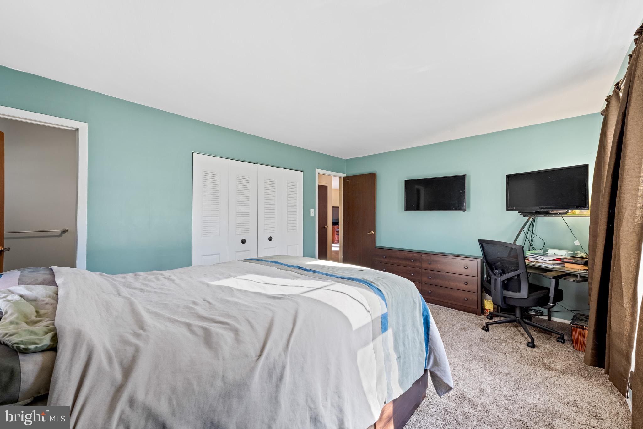 284 Radix Road Williamstown, NJ 08094 - Photo 15 of 30 a bedroom with a bed and a flat screen tv