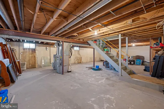 a view of an empty room with staircase