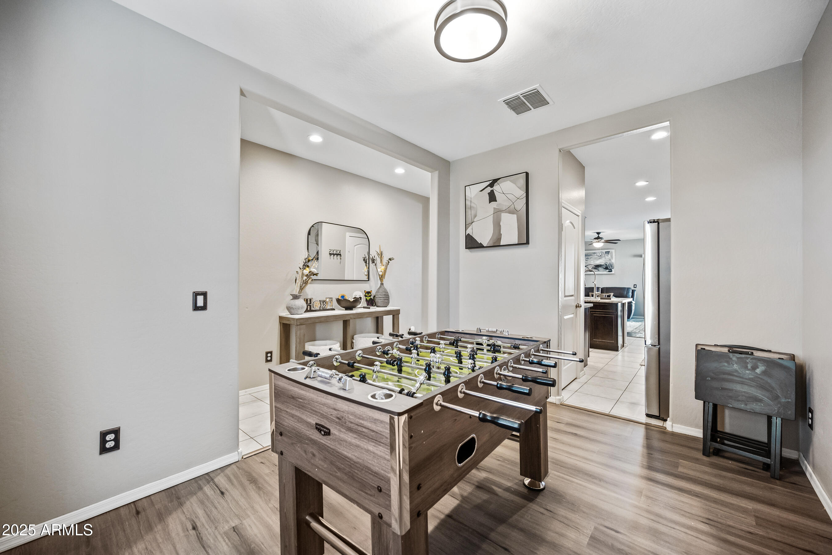 25626 West Coles Road Buckeye, AZ 85326 - Photo 15 of 31 a living room with furniture and a wooden floor