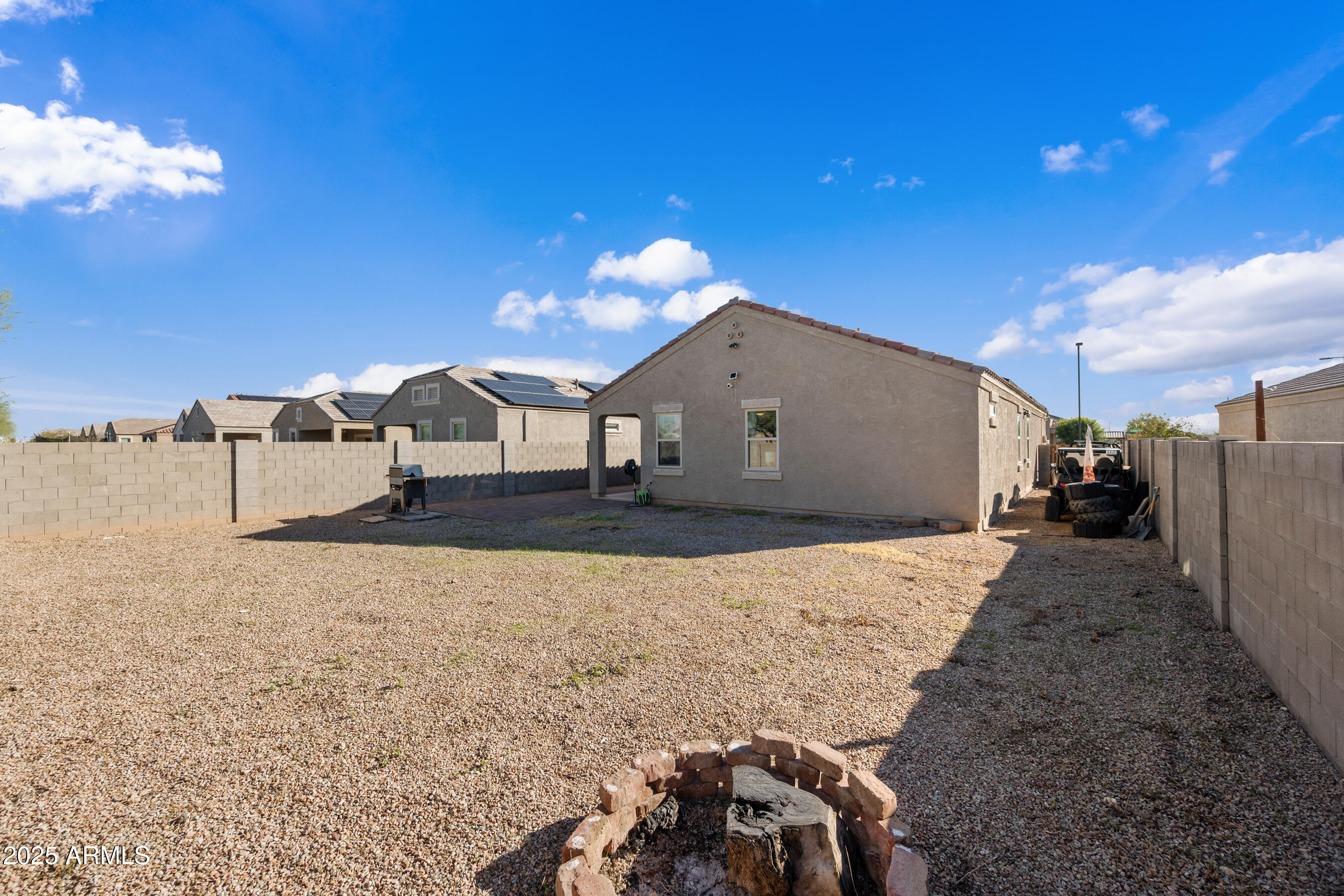 25626 West Coles Road Buckeye, AZ 85326 - Photo 30 of 31 a view of a house with a patio