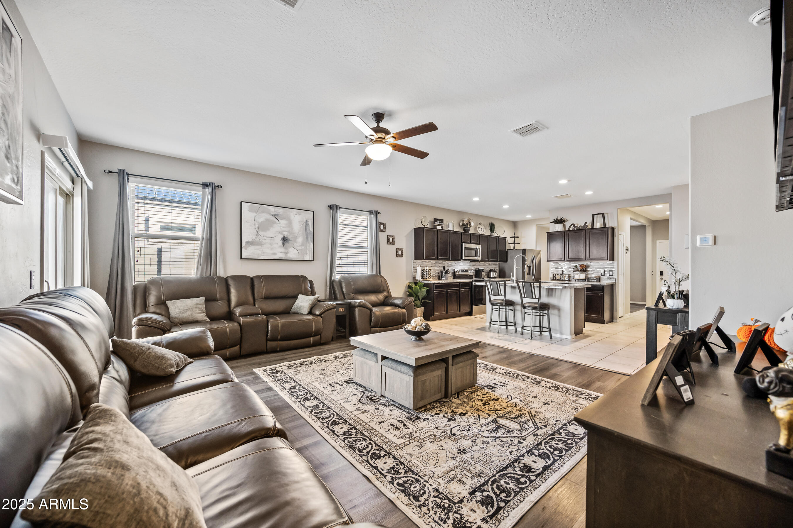 25626 West Coles Road Buckeye, AZ 85326 - Photo 7 of 31 a living room with furniture and wooden floor
